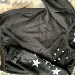 Black sweater with stars